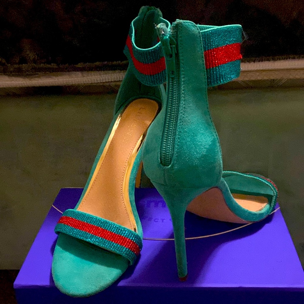 Green heels with red stripe at ankle